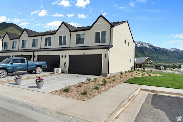 1563 E 720 N Unit 1071, Salem, UT 84653 - view of front of home with a mountain view, a garage, a front yard, concrete driveway, and stucco siding