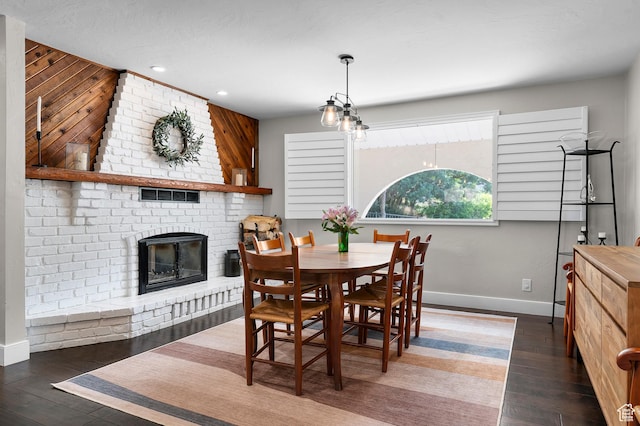 7968 S Titian St E, Cottonwood Heights, UT 84121 - dining room with hardwood / wood-style floors, a brick fireplace, and recessed lighting