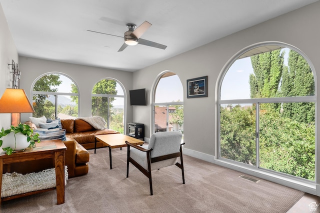 7968 S Titian St E, Cottonwood Heights, UT 84121 - living room featuring light colored carpet and a ceiling fan