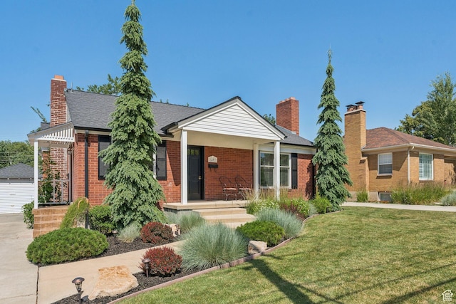 1492 S 2100 E, Salt Lake City, UT 84108 - view of front of house with brick siding, a front lawn, and a chimney