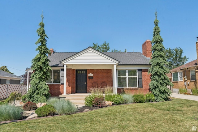 1492 S 2100 E, Salt Lake City, UT 84108 - bungalow-style home with brick siding, a chimney, and a shingled roof