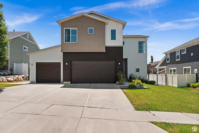 1578 E Maple Way, Layton, UT 84040 - view of front of house with stucco siding, driveway, and an attached garage