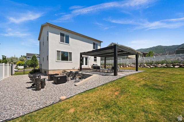 1578 E Maple Way, Layton, UT 84040 - back of house featuring an outdoor fire pit, a gazebo, a mountain view, a patio area, and a fenced backyard