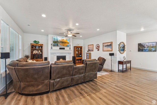 155 N 3830 W, West Point, UT 84015 - living area with light wood-type flooring, recessed lighting, ceiling fan, and a fireplace