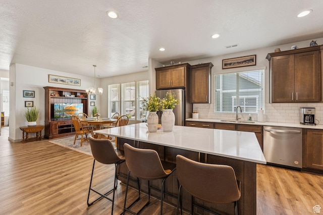 155 N 3830 W, West Point, UT 84015 - kitchen with stainless steel appliances, light countertops, tasteful backsplash, and recessed lighting