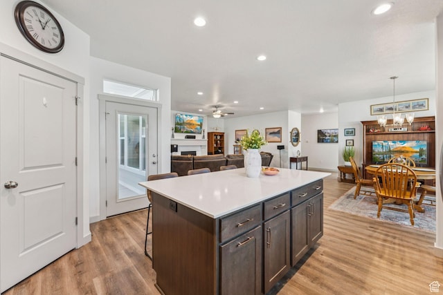 155 N 3830 W, West Point, UT 84015 - kitchen with light wood-style flooring, a chandelier, a center island, and recessed lighting