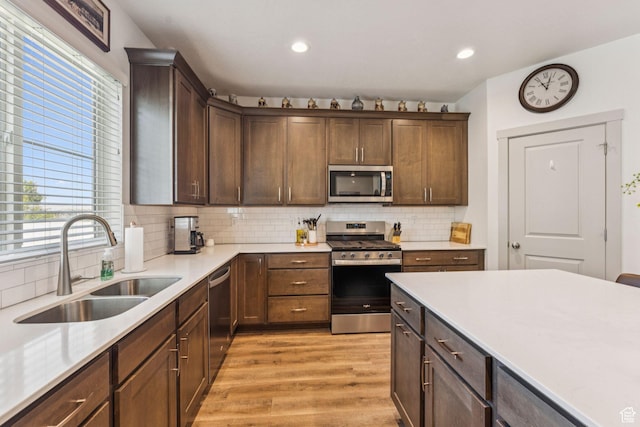 155 N 3830 W, West Point, UT 84015 - kitchen featuring stainless steel appliances, light wood-style floors, healthy amount of natural light, light countertops, and recessed lighting