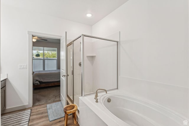 155 N 3830 W, West Point, UT 84015 - ensuite bathroom featuring a stall shower, a garden tub, wood finished floors, and vanity