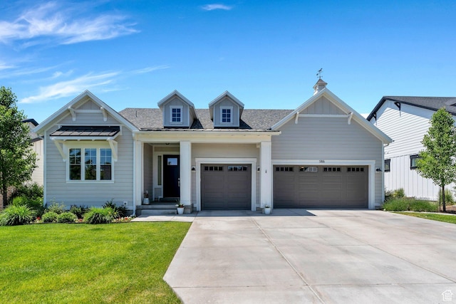 586 S Appenzell Ln W Unit 16, Midway, UT 84049 - view of front facade with an attached garage, concrete driveway, a front yard, and roof with shingles