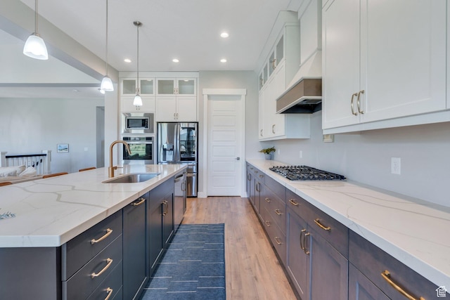 586 S Appenzell Ln W Unit 16, Midway, UT 84049 - kitchen featuring stainless steel appliances, recessed lighting, white cabinetry, light wood-style flooring, and custom exhaust hood