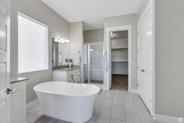 586 S Appenzell Ln W Unit 16, Midway, UT 84049 - full bathroom with vanity, a shower stall, a soaking tub, and tile patterned flooring