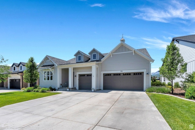 586 S Appenzell Ln W Unit 16, Midway, UT 84049 - view of front of house with a garage, concrete driveway, and a front lawn