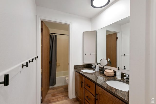 141 E 700 N Unit 29, Provo, UT 84606 - bathroom featuring double vanity, wood finished floors, and shower / bath combination with curtain