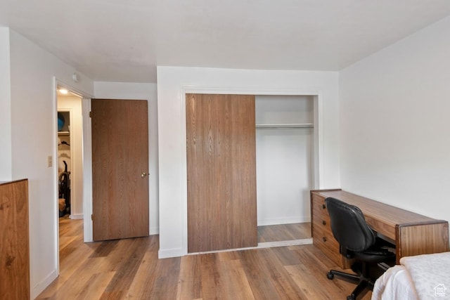 141 E 700 N Unit 29, Provo, UT 84606 - bedroom featuring wood finished floors, a closet, and a desk