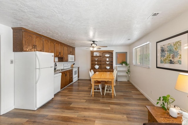 141 E 700 N Unit 29, Provo, UT 84606 - dining area with a ceiling fan, dark wood-style flooring, and a textured ceiling