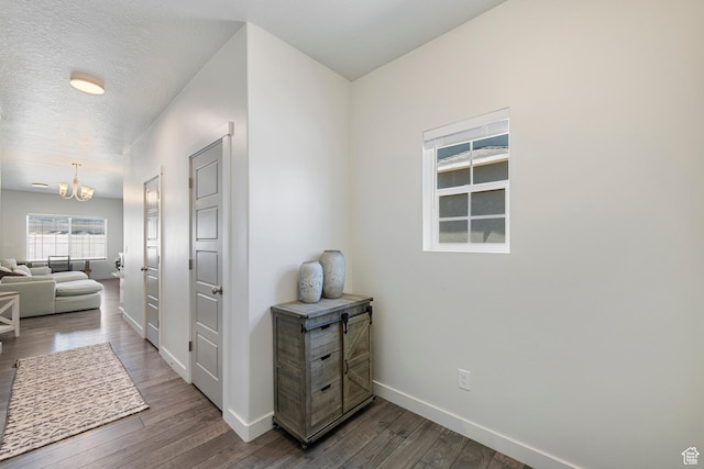 528 S Musk Ave W, Grantsville, UT 84029 - hall with a chandelier and dark wood finished floors