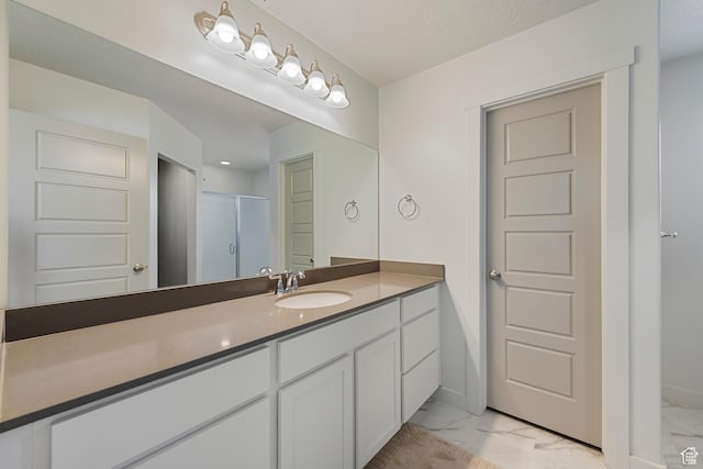 528 S Musk Ave W, Grantsville, UT 84029 - full bath featuring marble finish flooring, vanity, and a shower with shower door