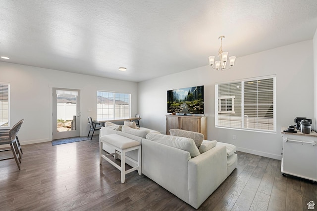 528 S Musk Ave W, Grantsville, UT 84029 - living room with a chandelier, dark wood-type flooring, recessed lighting, and a textured ceiling