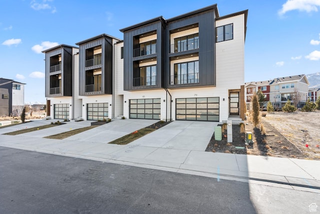 79 E Watson Dr, Saratoga Springs, UT 84045 - contemporary home with a garage, concrete driveway, and a residential view