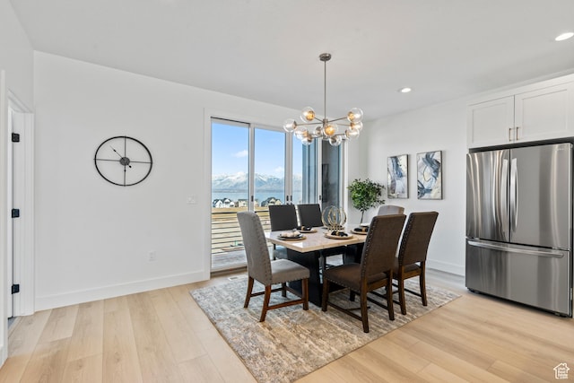 79 E Watson Dr, Saratoga Springs, UT 84045 - dining space with light wood-style flooring, a chandelier, recessed lighting, and a mountain view