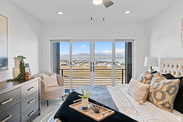 79 E Watson Dr, Saratoga Springs, UT 84045 - bedroom with access to exterior, multiple windows, a mountain view, light colored carpet, and recessed lighting