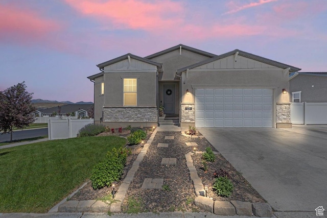 6228 N Boulter Peak Ln, Eagle Mountain, UT 84005 - single story home with stone siding, an attached garage, driveway, and board and batten siding