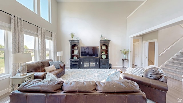 149 N 800 E, Salem, UT 84653 - living room with a high ceiling, healthy amount of natural light, wood finished floors, and stairs