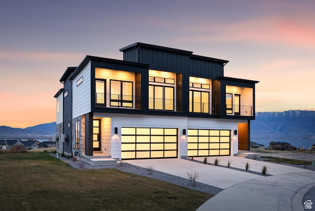78 Watson Dr, Saratoga Springs, UT 84045 - contemporary house with a garage, a balcony, board and batten siding, a yard, and driveway