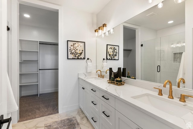 78 Watson Dr, Saratoga Springs, UT 84045 - bathroom featuring double vanity, a stall shower, marble finish floors, a spacious closet, and recessed lighting