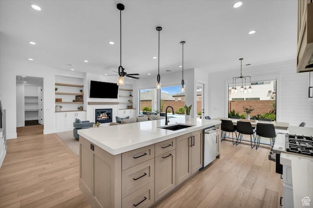 529 E 4290 S, Washington, UT 84780 - kitchen with a ceiling fan, dishwasher, a glass covered fireplace, light wood-type flooring, and recessed lighting