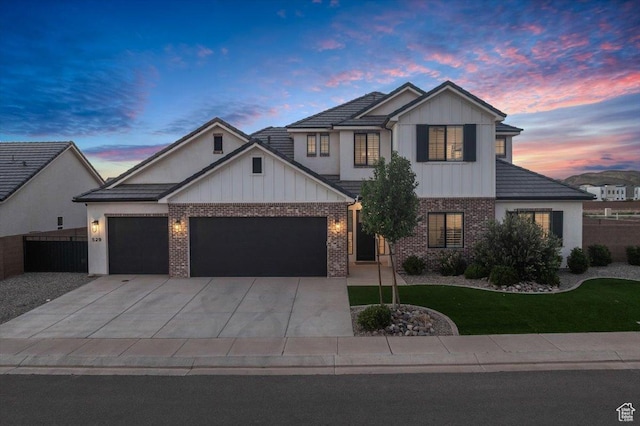 529 E 4290 S, Washington, UT 84780 - modern farmhouse featuring brick siding, an attached garage, board and batten siding, and driveway