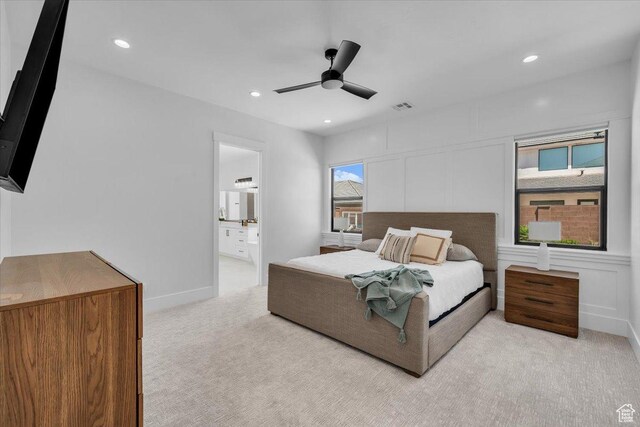 529 E 4290 S, Washington, UT 84780 - bedroom featuring light carpet, recessed lighting, ensuite bath, ceiling fan, and a decorative wall