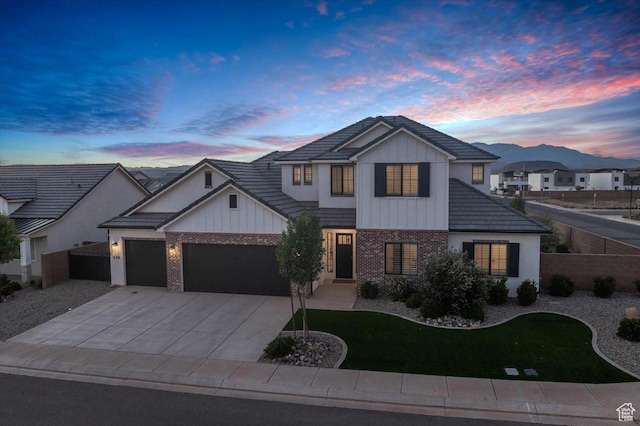 529 E 4290 S, Washington, UT 84780 - view of front facade with brick siding, board and batten siding, a garage, and driveway