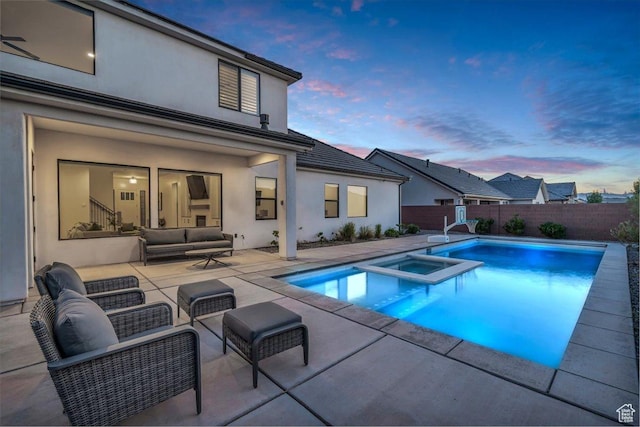 529 E 4290 S, Washington, UT 84780 - pool at dusk with outdoor lounge area, a patio, a pool with connected hot tub, and a fenced backyard