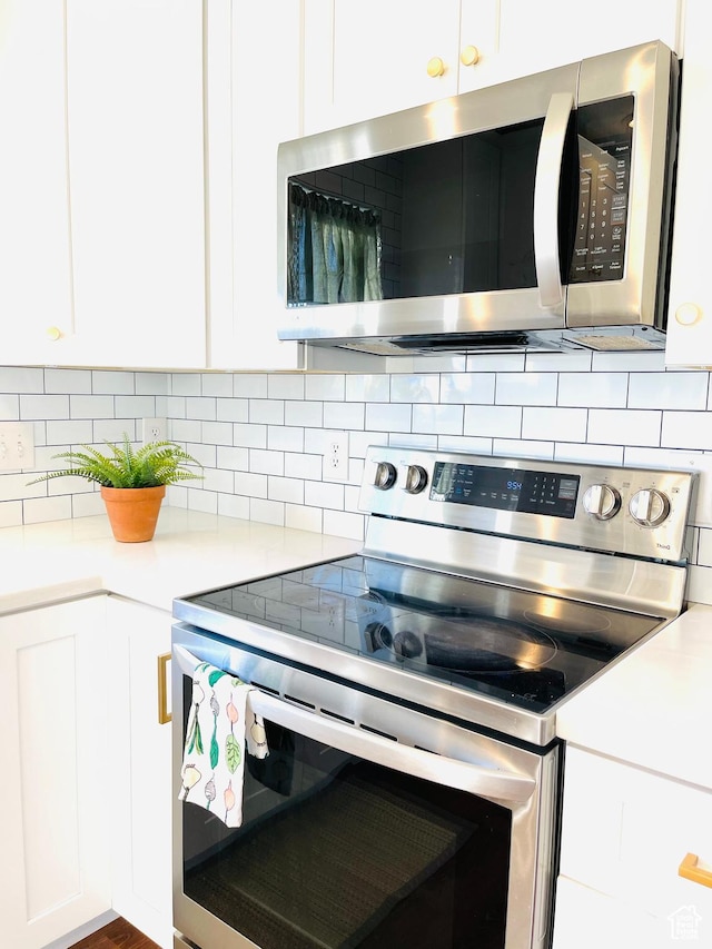 665 S 1040 E, Spanish Fork, UT 84660 - kitchen featuring appliances with stainless steel finishes, white cabinetry, and light countertops