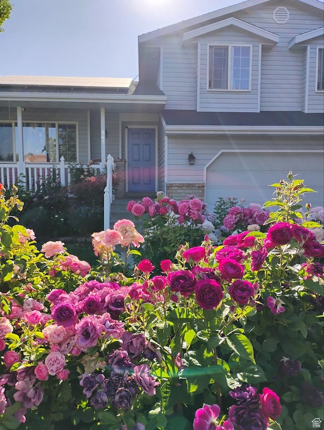 665 S 1040 E, Spanish Fork, UT 84660 - property entrance featuring a porch and an attached garage