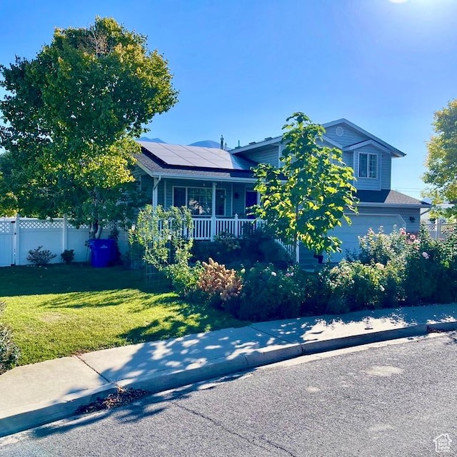 665 S 1040 E, Spanish Fork, UT 84660 - view of property hidden behind natural elements featuring roof mounted solar panels and covered porch