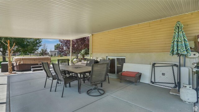 4403 W 3850 S, West Haven, UT 84401 - view of patio featuring a hot tub and outdoor dining area
