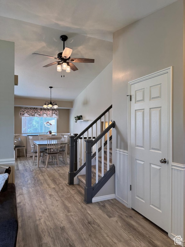 4403 W 3850 S, West Haven, UT 84401 - stairs with wood finished floors, a ceiling fan, a chandelier, and vaulted ceiling
