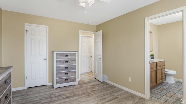 4403 W 3850 S, West Haven, UT 84401 - unfurnished bedroom featuring ensuite bathroom, light wood-type flooring, and a ceiling fan