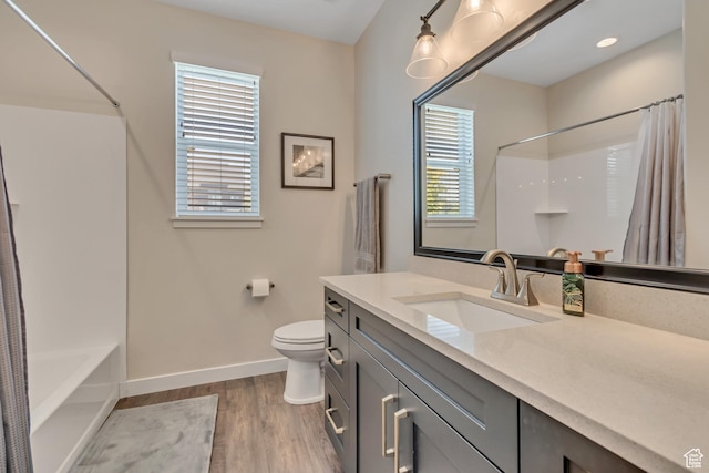 992 W Emily Francis Cir S, Jordan, UT 84095 - bathroom featuring wood finished floors, vanity, and shower / tub combo
