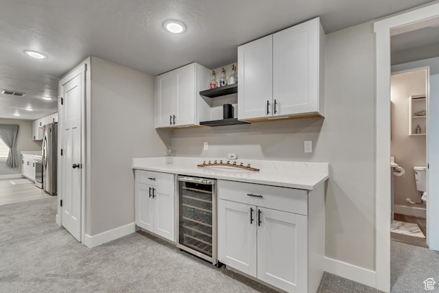 992 W Emily Francis Cir S, Jordan, UT 84095 - indoor wet bar featuring beverage cooler, freestanding refrigerator, light colored carpet, and recessed lighting