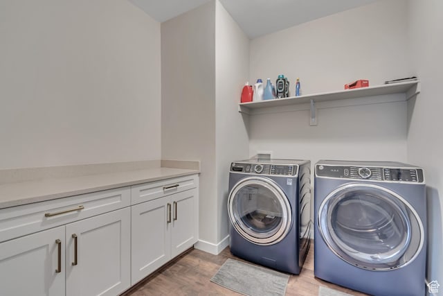 992 W Emily Francis Cir S, Jordan, UT 84095 - laundry room with washer and clothes dryer, wood finished floors, and cabinet space