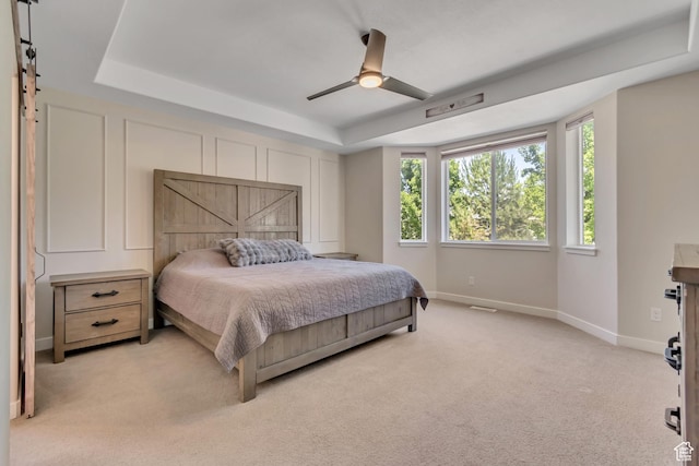 992 W Emily Francis Cir S, Jordan, UT 84095 - bedroom with a tray ceiling, light carpet, and ceiling fan
