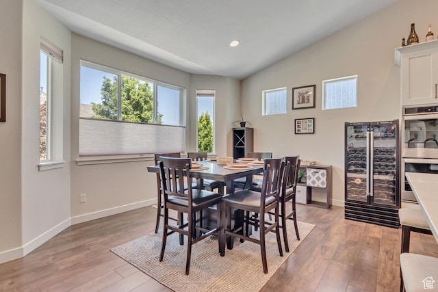992 W Emily Francis Cir S, Jordan, UT 84095 - dining room with light wood-type flooring, vaulted ceiling, and recessed lighting