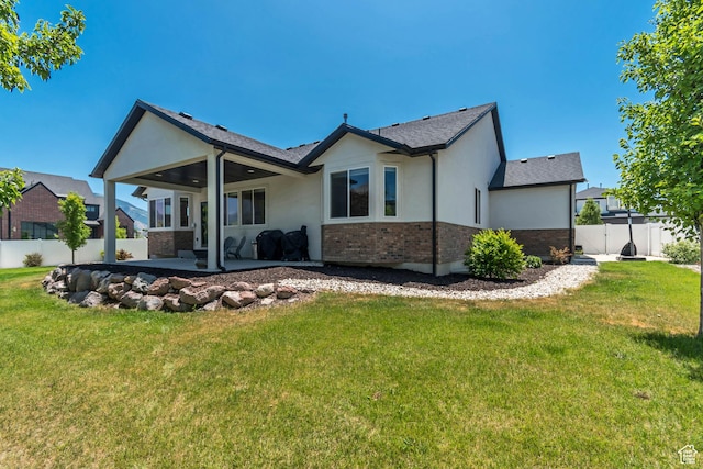 992 W Emily Francis Cir S, Jordan, UT 84095 - rear view of house with stucco siding, a patio, and brick siding