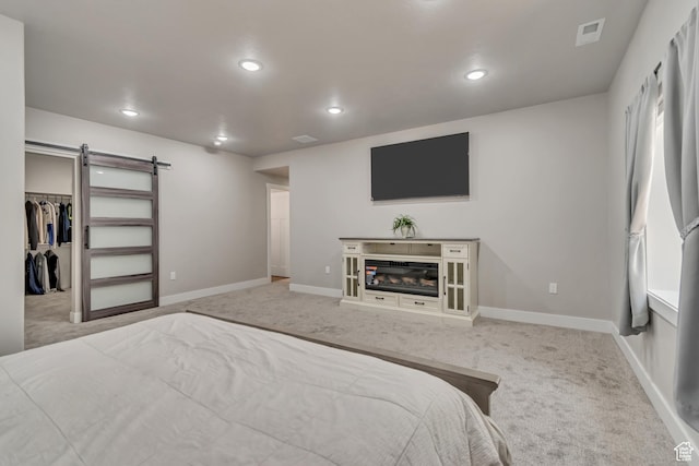 992 W Emily Francis Cir S, Jordan, UT 84095 - bedroom with carpet, a barn door, recessed lighting, and a walk in closet