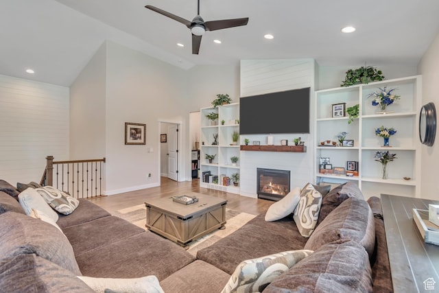 992 W Emily Francis Cir S, Jordan, UT 84095 - living room featuring ceiling fan, high vaulted ceiling, light wood finished floors, a fireplace, and recessed lighting