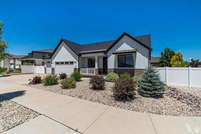 992 W Emily Francis Cir S, Jordan, UT 84095 - modern farmhouse style home featuring board and batten siding, a garage, concrete driveway, and brick siding
