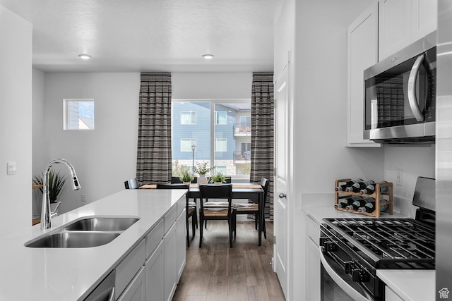 1286 N 375 S Unit 148, Harrisville, UT 84404 - kitchen featuring stainless steel appliances, light wood-style floors, light countertops, white cabinets, and recessed lighting